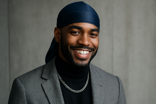 fashionable man smiling wearing a dark blue durag